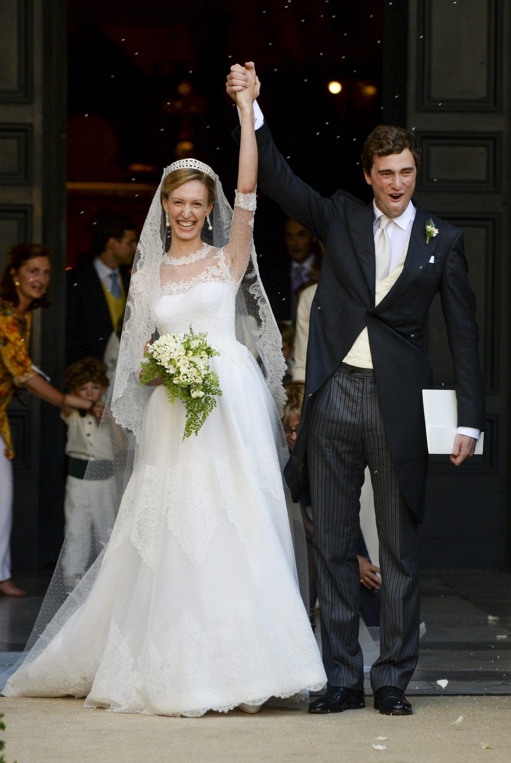 Roma July 5, 2014
Wedding of Prince Amedeo , nephew of King Philippe of Belgium, and Mlle. Elisabetta Maria Rosboch von Wolkenstein at the Basilica di Santa Maria in Trastevere. Prince Amedeo ( born on 21 February 1986 ) is the elder son of Princess Astrid, (sister of King Philippe) and archduke Lorenz. Elisabetta ( nickname Lili - born in Roma on 9 September 1987 ) is the daughter of Ettore Rosboch von Wolkenstein and Countess Lilia de Smecchia . He has studied Finance and she is journalist and photographer. They met in London a few years ago when the Prince was studying at the London School of Economics and Political Sciences.
Pix....   Prince Amedeo / Elisabetta Maria Rosboch von Wolkenstein ( Lili ) 
Credit Frederic Sierakowski / Isopix