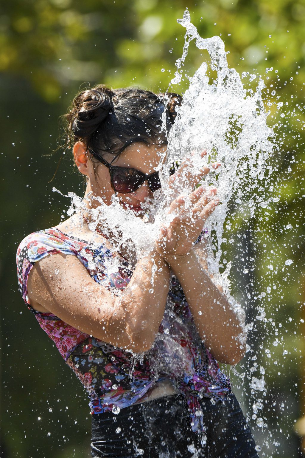Oostende, 26/07/2018
heat wave in belgium, people get refreshed and seek freshness at the fountain place Flagey 
Credit : Frederic Sierakowski / Isopix